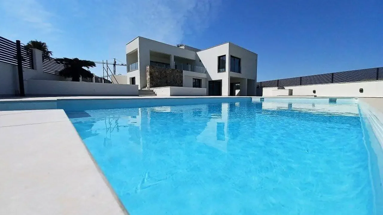 Exterior view of a private pool at an Alicante seafront house